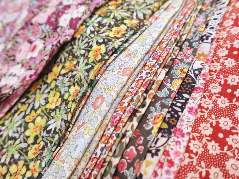 A Selection of Liberty London Floral Prints ranging from reds, to greens, to multi-colored cotton