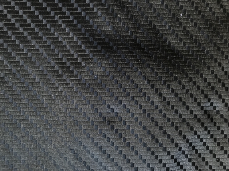 black silk brocade with repeating geometric pattern